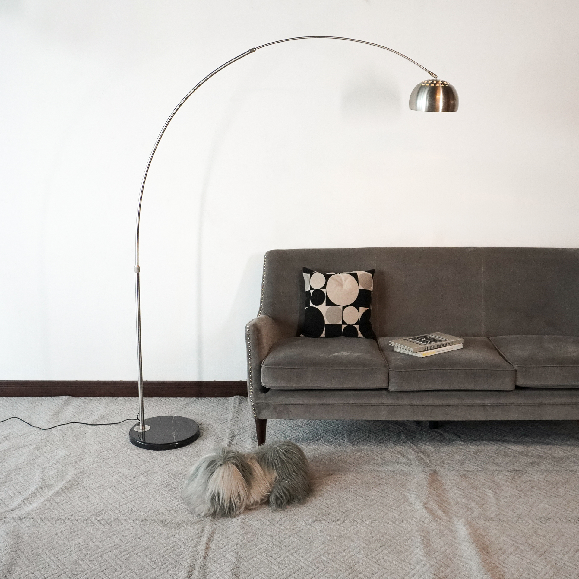 Sleek chrome arch modern lamp warm lighting