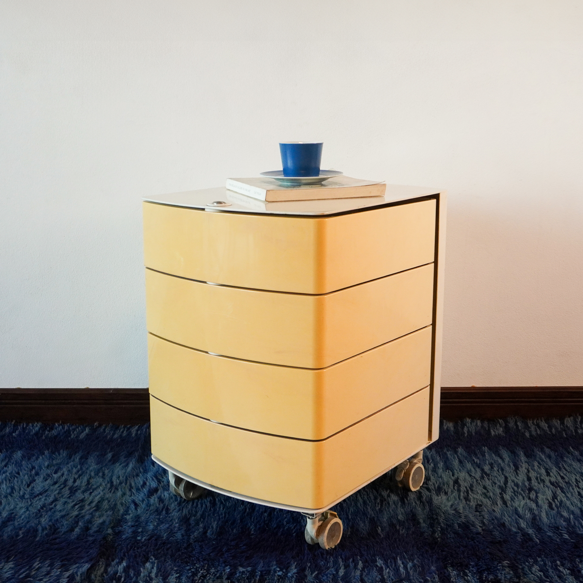 Plastic office unit. 4-drawer on casters original design.