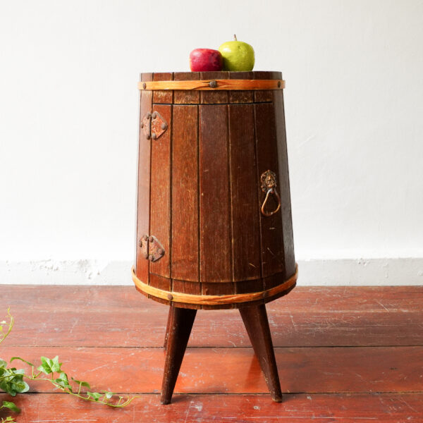 Barrel-shaped minibar in wood and bronze