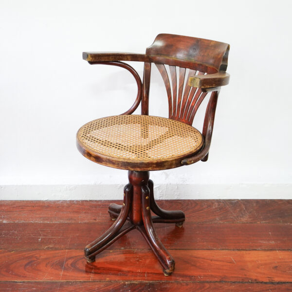 Bent wood captains chair, With wicker seating in top .1950s